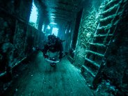 Diver in shipwreck