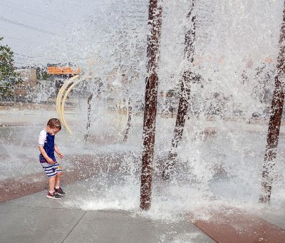 kid splashing in water
